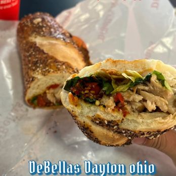 DiBella's Subs - a person holding a sandwich - Sandwiches Near Me - Beavercreek, Ohio DiBella's Subs - a person holding a sandwich - Sandwiches Near Me - Beavercreek, Ohio