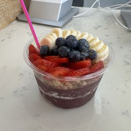 Açaí bowl with granola, strawberries, blueberries, banana, and honey Açaí bowl with granola, strawberries, blueberries, banana, and honey