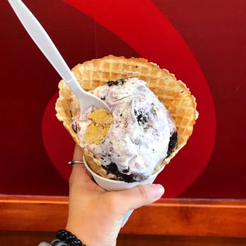 Cold Stone Creamery - a hand holding a waffle cone - Ice Cream & Frozen Yogurt Near Me - Branson, Missouri