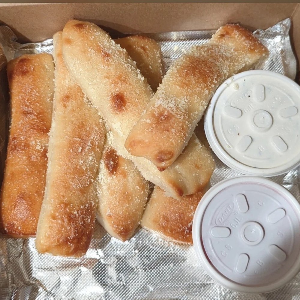 Primo's Pizzeria - Famous Bread Sticks With Butter & Parmesan Cheese Dipping Sauce Garlic Butter Tomato Sauce Ranch - Pizza Near Me - Livonia, Michigan Primo's Pizzeria - Famous Bread Sticks With Butter & Parmesan Cheese Dipping Sauce Garlic Butter Tomato Sauce Ranch - Pizza Near Me - Livonia, Michigan