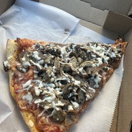 Disappointing slice of mushroom and sausage Disappointing slice of mushroom and sausage
