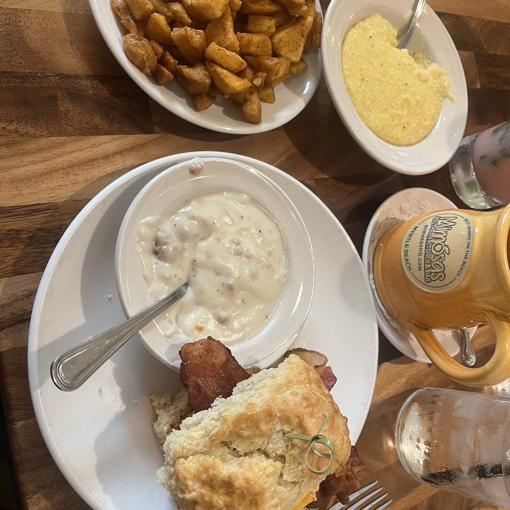 Mimosas - Chicken biscuit with sides of home fries and grits - Breakfast & Brunch Near Me - Myrtle Beach, South Carolina Mimosas - Chicken biscuit with sides of home fries and grits - Breakfast & Brunch Near Me - Myrtle Beach, South Carolina