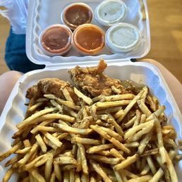Two fresh tenders & fries galore (with 5 sauces I ordered) Two fresh tenders & fries galore (with 5 sauces I ordered)