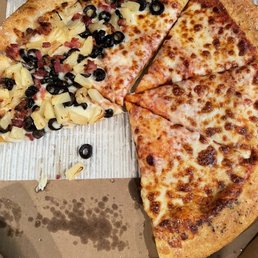 a pizza in a box with a slice missing
