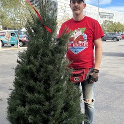 Mr Jingle's Christmas Trees - One of the boys with a finalist