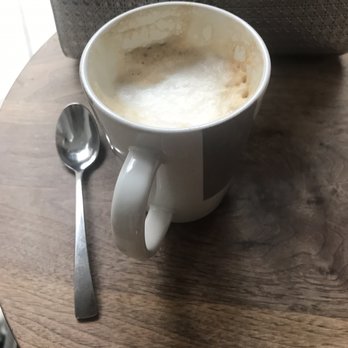 A.cafe - Partially dranken latte. Good, but no artwork and $5 is pretty steep. - Cafes Near Me - New York, New York
