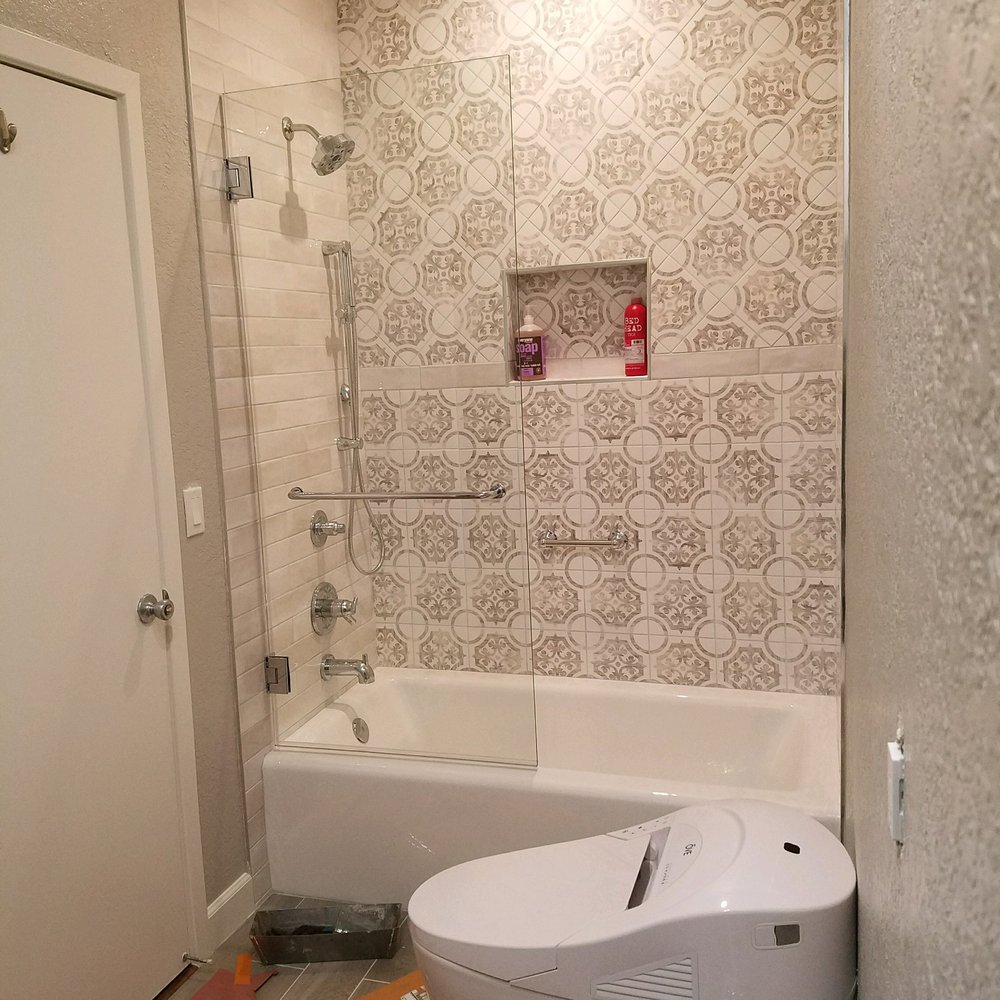 a bathroom with a toilet and bathtub a bathroom with a toilet and bathtub