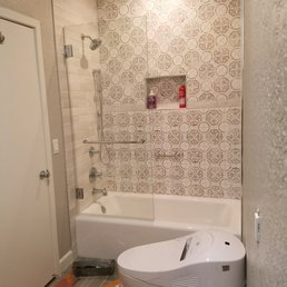 a bathroom with a toilet and bathtub