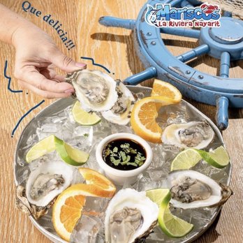 Mariscos La Riviera Nayarit - a plate of oysters on ice with lime wedges - Seafood Near Me - Lawrenceville, Georgia Mariscos La Riviera Nayarit - a plate of oysters on ice with lime wedges - Seafood Near Me - Lawrenceville, Georgia