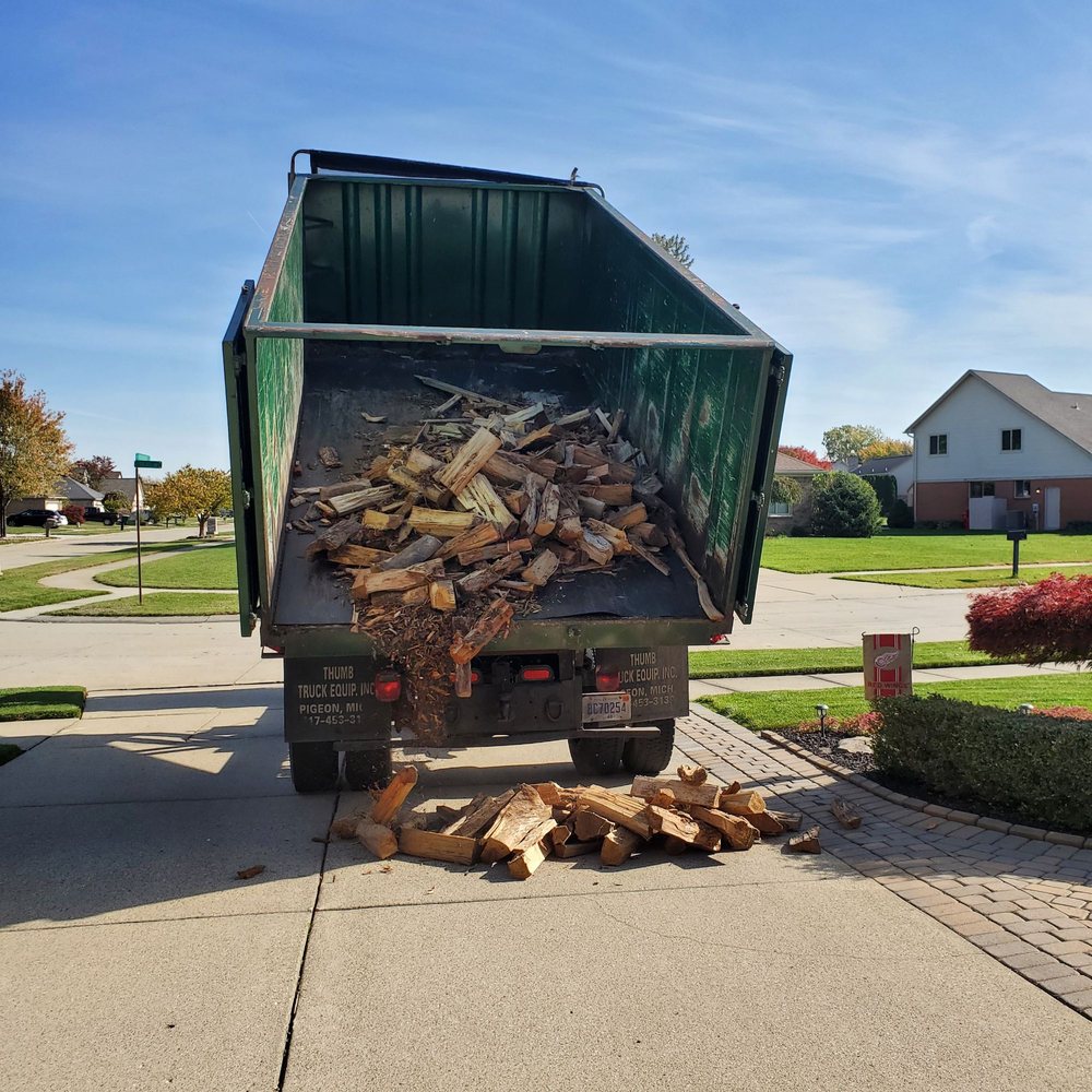 PJ Hebert - Driver Geoff is power unloading a full face cord of firewood. 10/22/2022 - Landscaping Near Me - Shelby Township, Michigan PJ Hebert - Driver Geoff is power unloading a full face cord of firewood. 10/22/2022 - Landscaping Near Me - Shelby Township, Michigan