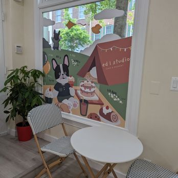 Ed Studio - a table and chairs in front of a window - Desserts Near Me - Gaithersburg, Maryland