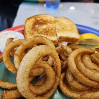 Newport Cafe - Crab melt with onion rings - Burgers Near Me - Newport, Oregon Newport Cafe - Crab melt with onion rings - Burgers Near Me - Newport, Oregon