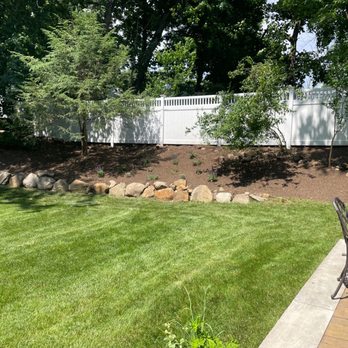 White Birch Landscape Design - a backyard with a swing set - Tree Services Near Me White Birch Landscape Design - a backyard with a swing set - Tree Services Near Me
