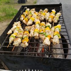 Grill chicken skewers with peppers and onions