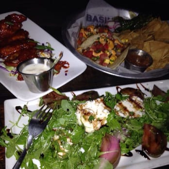 Basin 141 - Top left: wings, top right: pork belly tacos, bottom: heirloom tomato salad - Pubs Near Me - Montrose, California