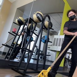 LA Fitness - I'm glad they are cleaning but maybe next time wait until your guest is done stretching to mop the dirt onto them....