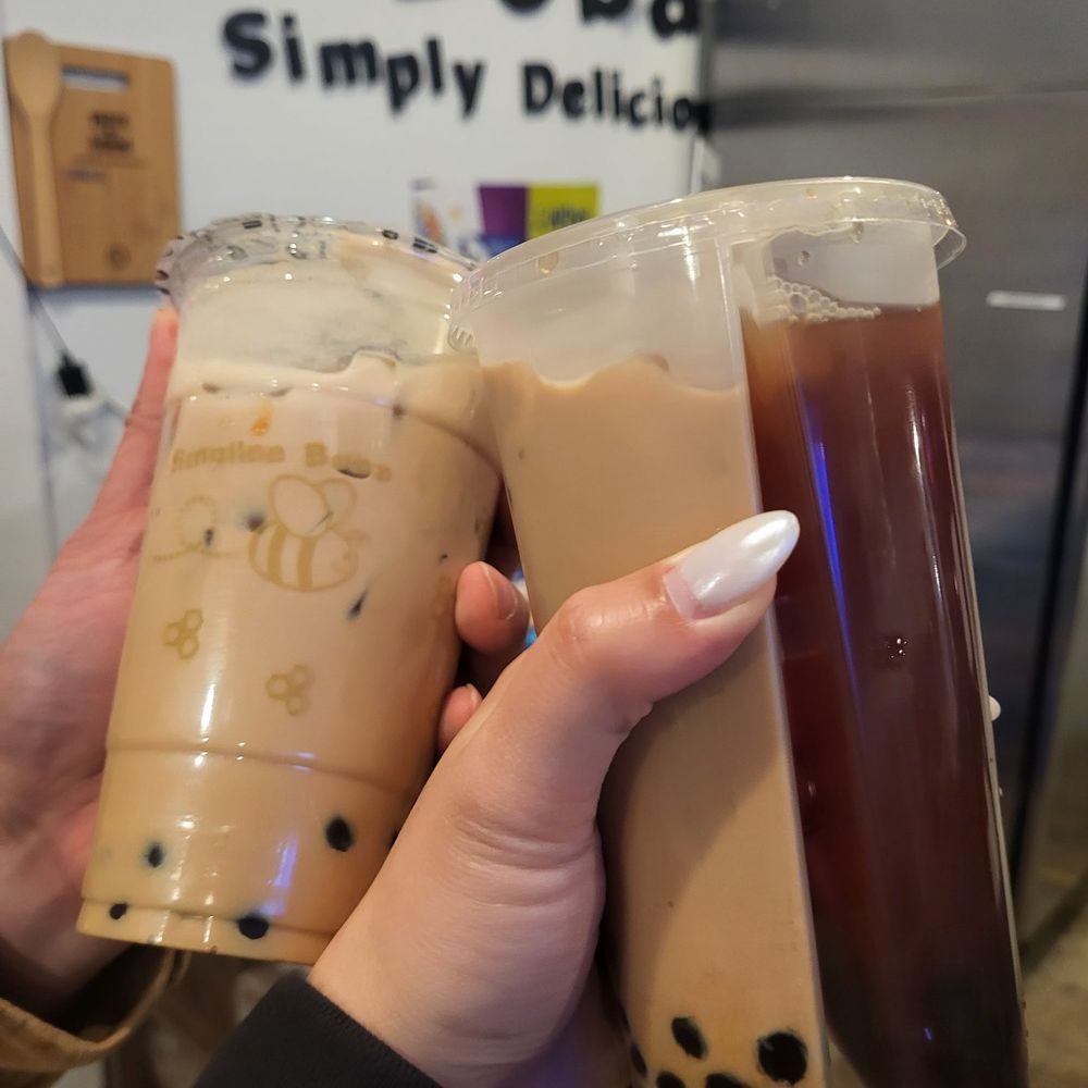 almond milk tea & house milk tea/ strawberry black tea split cup almond milk tea & house milk tea/ strawberry black tea split cup
