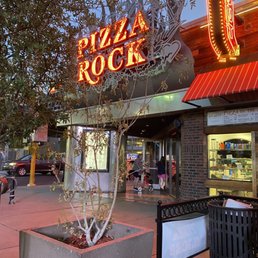Exterior outside entrance of Pizza Rock - View of front door of Pizza Rock downtown Las Vegas from outdoor seating in June 2022. - Las Vegas, Nevada Exterior outside entrance of Pizza Rock - View of front door of Pizza Rock downtown Las Vegas from outdoor seating in June 2022. - Las Vegas, Nevada