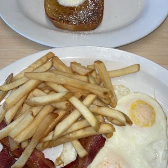 The Toasted Yolk Cafe - 2eggs any style with a side of French toast. - Breakfast & Brunch Near Me - Round Rock, Texas The Toasted Yolk Cafe - 2eggs any style with a side of French toast. - Breakfast & Brunch Near Me - Round Rock, Texas