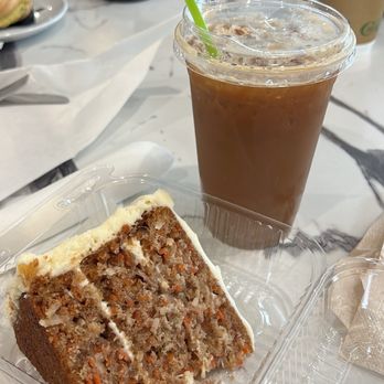 Grand Finale Bistro & Cafe - Carrot cake and iced pistachio latte with oat milk - Bakeries Near Me - Spring Lake, Michigan Grand Finale Bistro & Cafe - Carrot cake and iced pistachio latte with oat milk - Bakeries Near Me - Spring Lake, Michigan