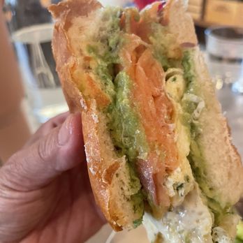 Evelina - The slice view of the salmon sandwich - Smashed avocado, chive scrambled eggs, goat cheese, brioche bun, salad - Italian Near Me - Brooklyn, New York Evelina - The slice view of the salmon sandwich - Smashed avocado, chive scrambled eggs, goat cheese, brioche bun, salad - Italian Near Me - Brooklyn, New York