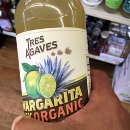 hand holding a bottle hand holding a bottle