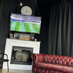 Waiting area with TV and fireplace