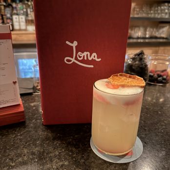 Lona - jalapeño-infused tequila passion fruit / lemon hibiscus rosemary foam - New Mexican Cuisine Near Me - Nashville, Tennessee