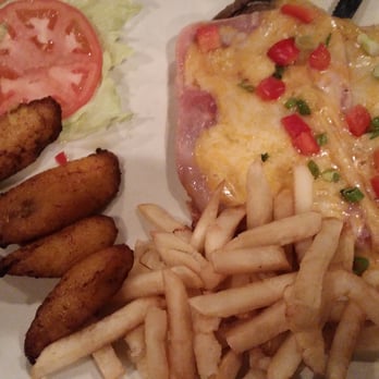 Happy Fish - Plantains, fries & cheese covered entree. - Peruvian Near Me - Tampa, Florida Happy Fish - Plantains, fries & cheese covered entree. - Peruvian Near Me - Tampa, Florida