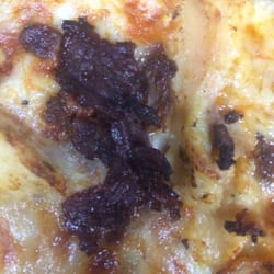 Domino's Pizza - I complained that my pizza was burned and the owner says I'm wrong .