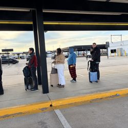 Hertz Rent A Car - The first photo is the rude Hertz employee. The second picture show half of the line and the empty parking lot