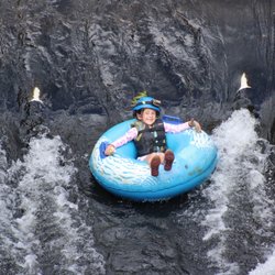 Kaua'i Backcountry Adventures - 6 year old tubing through sugar cane irrigation tunnels