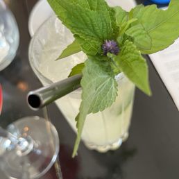 Practical Magic with an adorable mint flower in the garnish Practical Magic with an adorable mint flower in the garnish