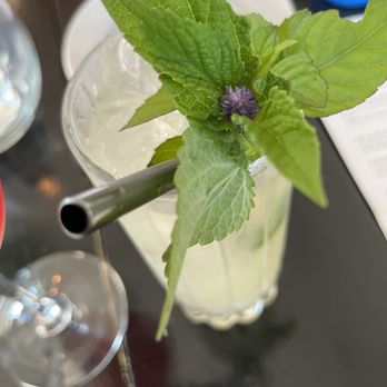 Strange Town - Practical Magic with an adorable mint flower in the garnish - Vegan Near Me - Milwaukee, Wisconsin Strange Town - Practical Magic with an adorable mint flower in the garnish - Vegan Near Me - Milwaukee, Wisconsin