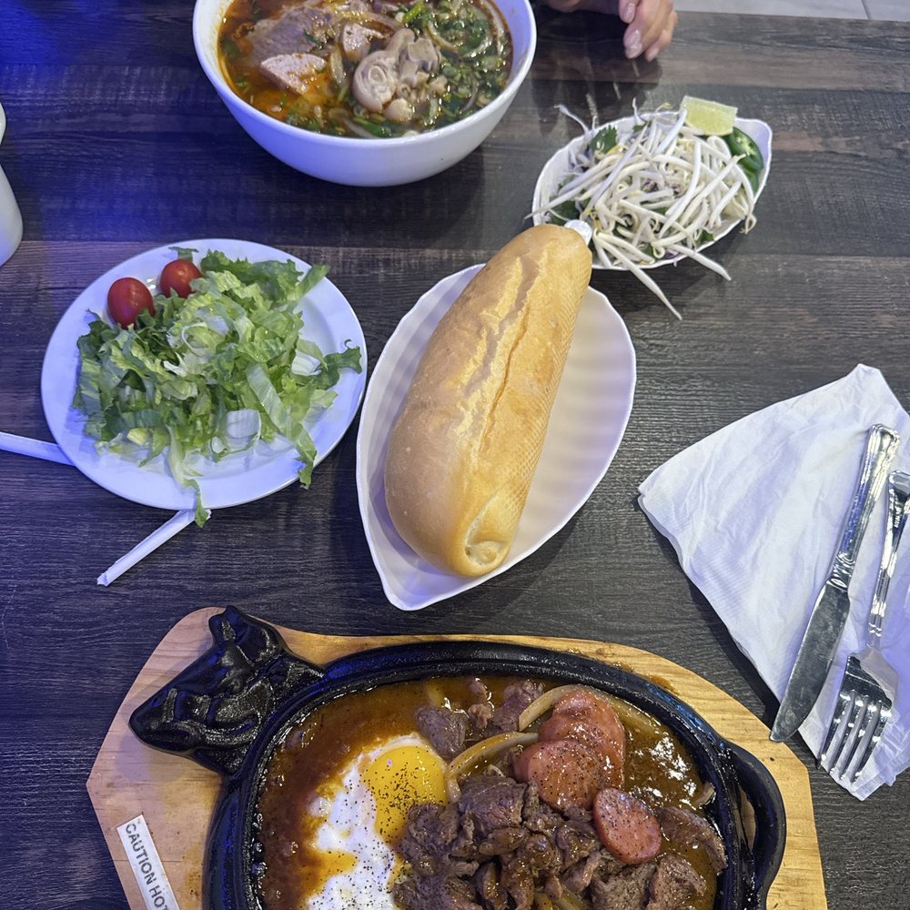 Shaken beef with bread and spicy beef soup (bun bo hue)