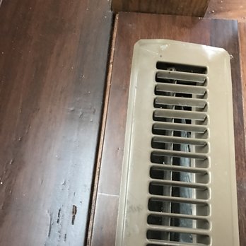 Ritchie Floors - Installer hammered down vent cover. Look at gap! - Flooring Near Me - Saint Charles, Illinois