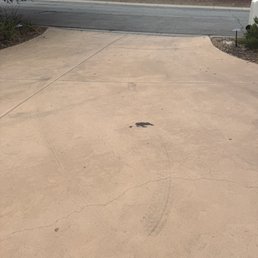 This is how they left my driveway. Look at the tire marks and the oil spilled besides not having hot water.
