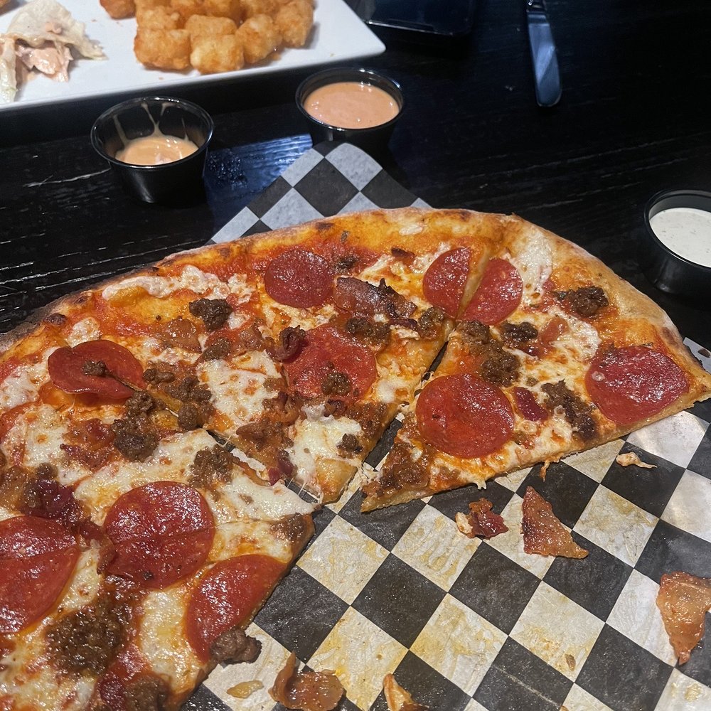 Midtown Tavern - Three meat pizza - American Near Me - Charlotte, North Carolina Midtown Tavern - Three meat pizza - American Near Me - Charlotte, North Carolina