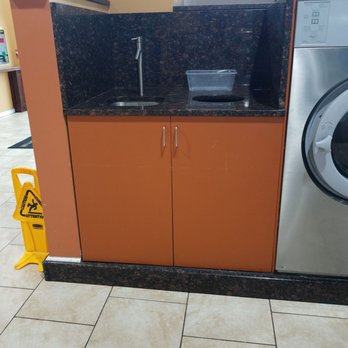 Laundry City Laundromat - Sink and Waste Basket on every other row. Convenient - Laundromat Near Me - Baltimore, Maryland