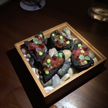 Senia - The perfect bite. Squid ink crackers. Avocado mousse. Ikura. - Cocktail Bars Near Me - Honolulu, Hawaii Senia - The perfect bite. Squid ink crackers. Avocado mousse. Ikura. - Cocktail Bars Near Me - Honolulu, Hawaii