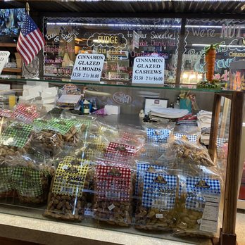 Port Jefferson Outpost - a display case filled with food - Candy Stores Near Me - Jefferson, Texas