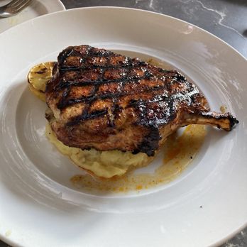Seasons 52 - wood grilles dry rubbed pork chop w/ subbed mash potatoes - New American Near Me - Costa Mesa, California