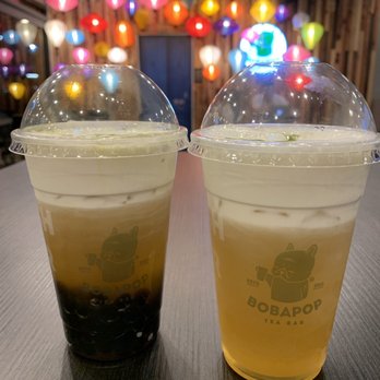 BoBaPoP - Two milk foam flower green teas (one with boba and one without) with cool lantern decor in the background - Coffee & Tea Near Me - San Gabriel, California BoBaPoP - Two milk foam flower green teas (one with boba and one without) with cool lantern decor in the background - Coffee & Tea Near Me - San Gabriel, California