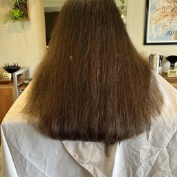 Photo from a different hair salon as they were fixing it. Super uneven and you can see the super long hair near the middle.
