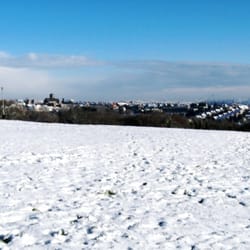Cold Knap Beach - A snowy scene on the green on the cliff above Cold Knap Beach, looking towards Barry (with All Saints church on the skyline).