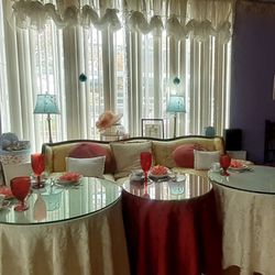 The Purple Door Tea Room - Inside. Davenports with tables of various party seatings. We're told to seat ourselves.