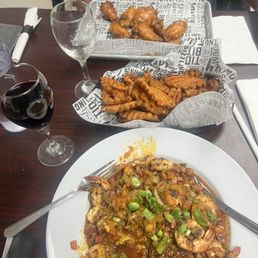 Shrimp grits special, sweet potato waffle fries, chicken wings. Shrimp grits special, sweet potato waffle fries, chicken wings.