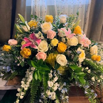 Jenna's Florist - My mom loved yellow roses, her dress was a blush with irredescent embellishment. These flowers, the colors and the design, were perfect - Florists Near Me - Fair Oaks, California Jenna's Florist - My mom loved yellow roses, her dress was a blush with irredescent embellishment. These flowers, the colors and the design, were perfect - Florists Near Me - Fair Oaks, California