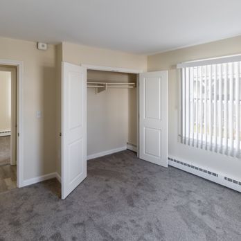Landings Apartment Community - Bedroom with closet doors open. - Apartments Near Me - Middletown, Rhode Island Landings Apartment Community - Bedroom with closet doors open. - Apartments Near Me - Middletown, Rhode Island