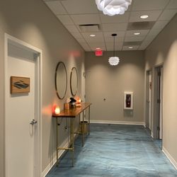 The Float Spa Holly Springs - Hallway outside the float rooms, lobby and relaxation room